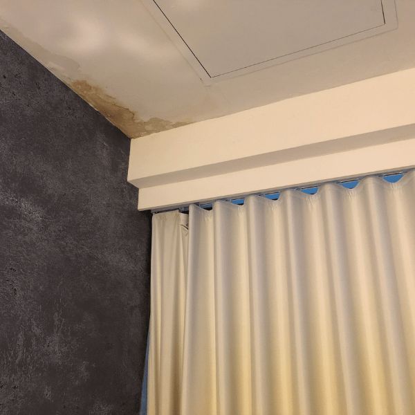 Water damage in the corner of a hotel room
