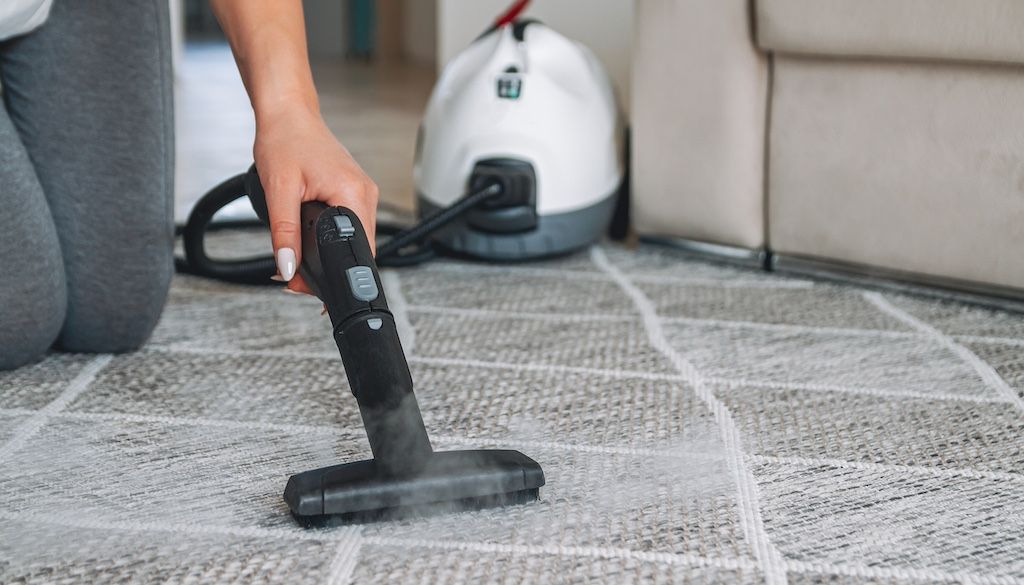 using machine to steam clean carpet
