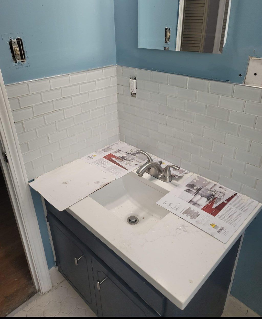 Installed faucet and backsplash