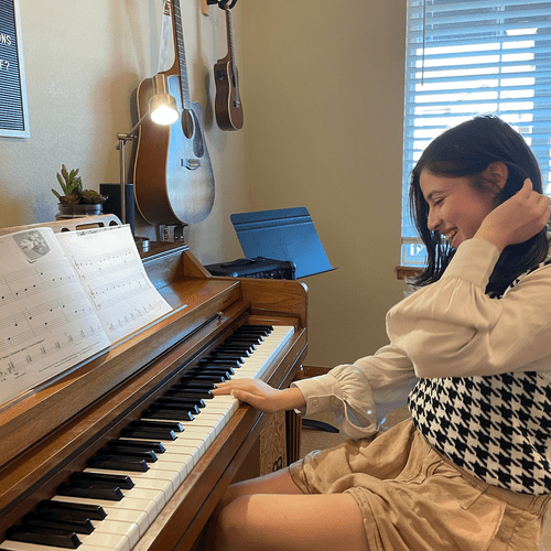Carolena enjoys playing songs from her method book