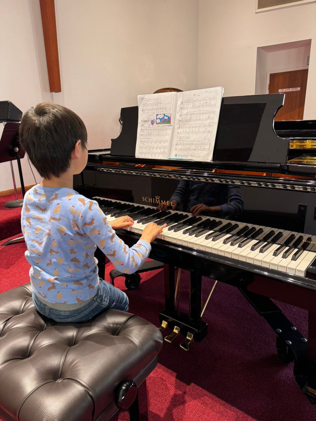 You will be playing on this beautiful grand piano!