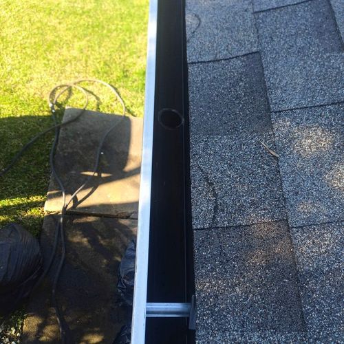 Cleaned our gutters and made a minor roof repair f