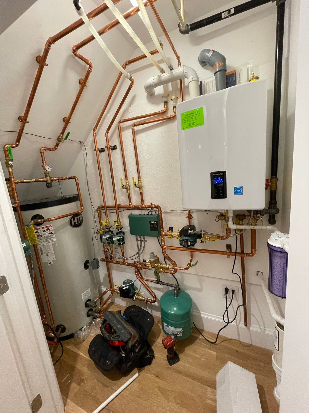 A navien wall hung boiler with two zones of heat s