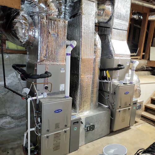 2 new 96.7 2 stage Carrier furnaces in basement in