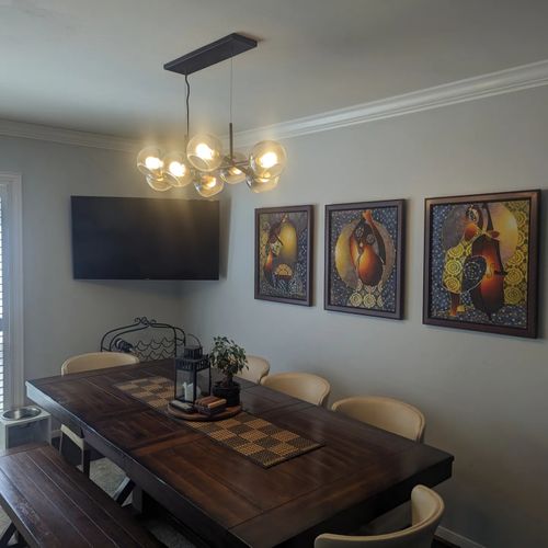 TV mounted, pictures are hanged, light fixtures on