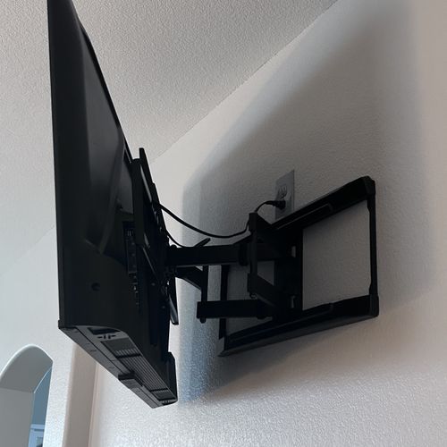 TV mounting and added receptacle to conceal cables