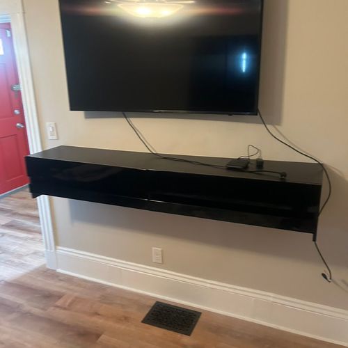 Tv mount and floating tv stand  installed 