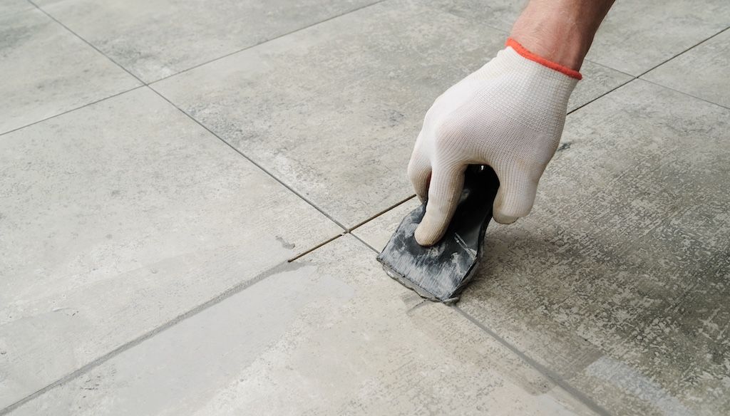 applying grout to ceramic tile floors