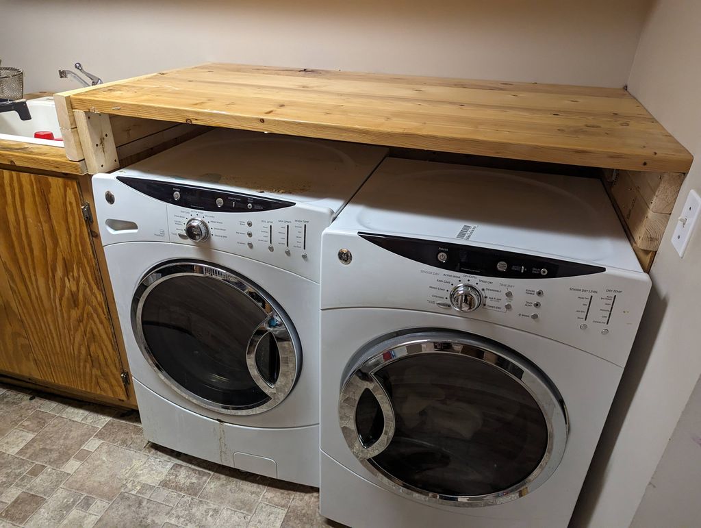 Raised countertop to fit new washer/dryer. Aesthet