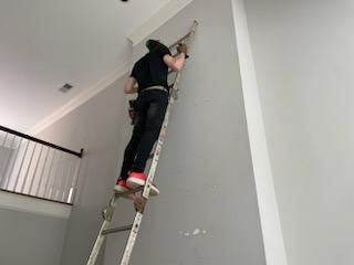 16 ft high up patching holes in drywall!