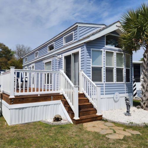 Kevin washed and stained our beach property deck! 