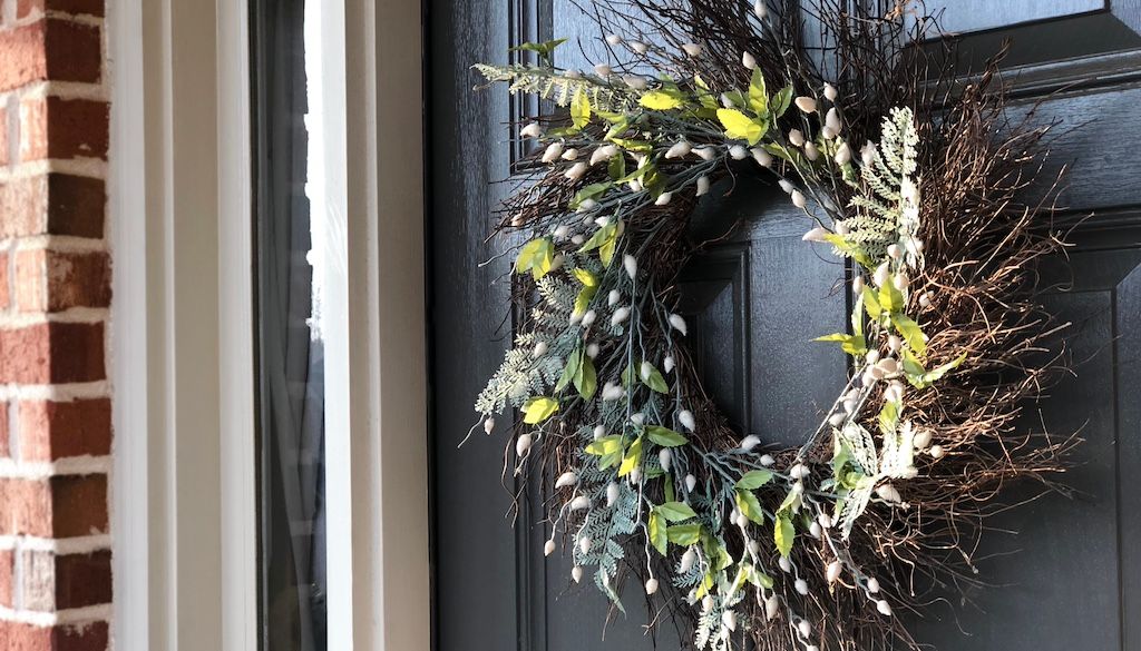 spring wreath on front porch door