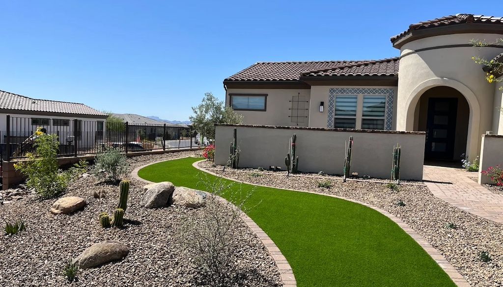 desert front yard landscape with gravel and synthetic turf