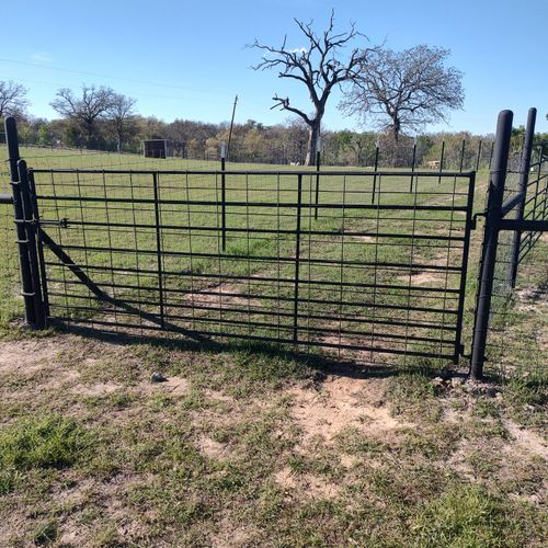 Clean and Painted gates and pipe Fencing 