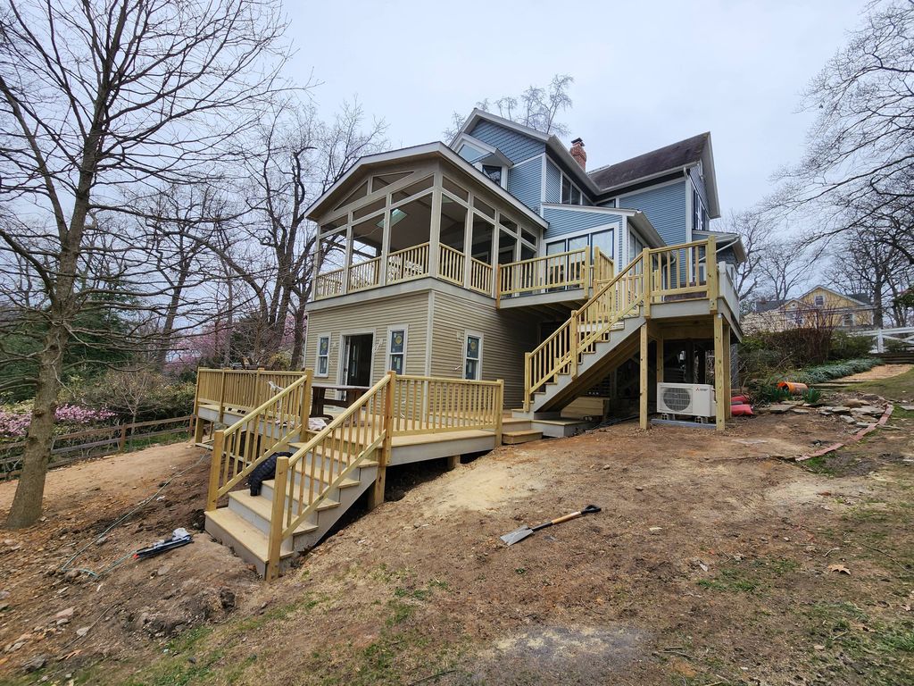 Addition on the first floor and screen porch on th