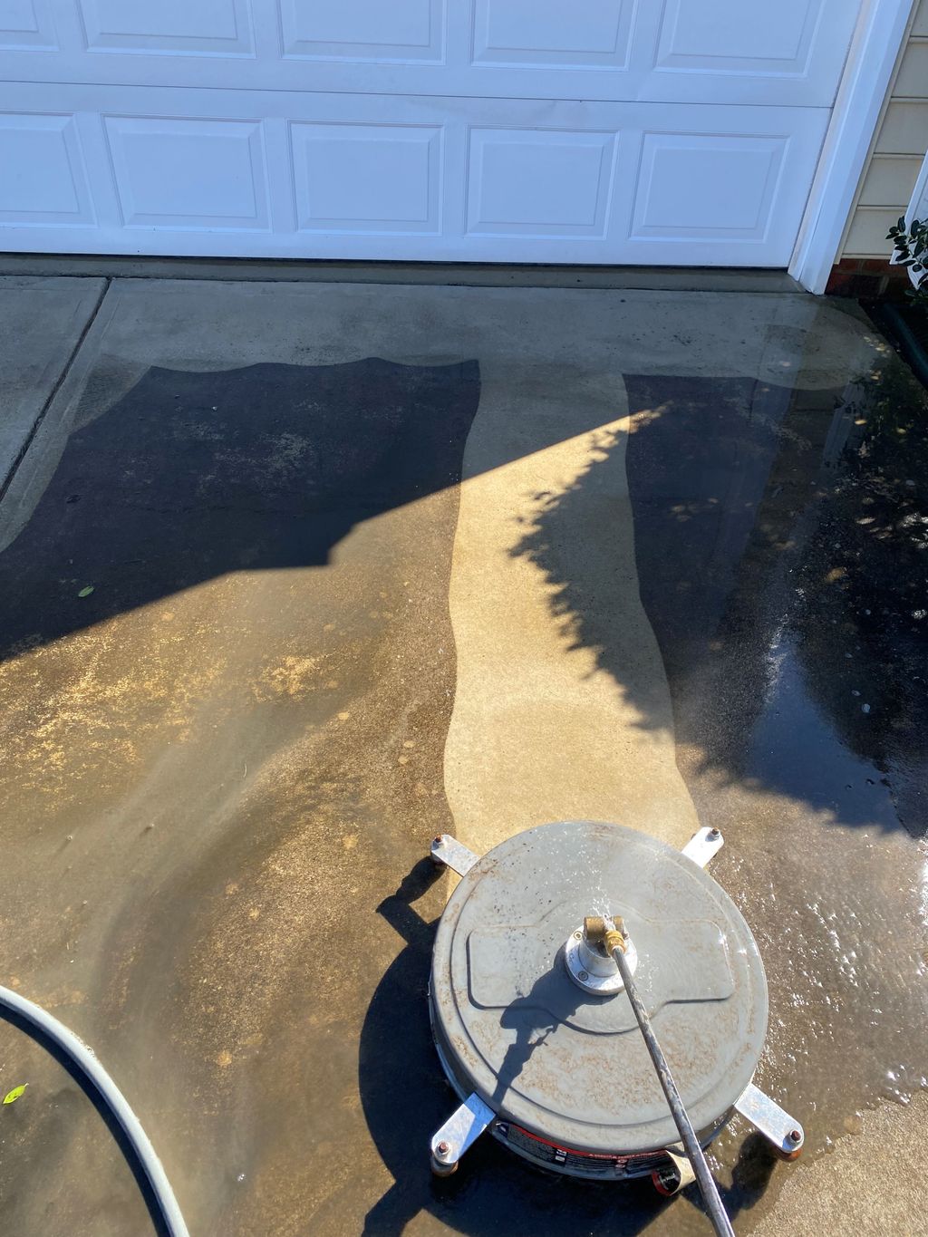 Flat surface cleaning a driveway