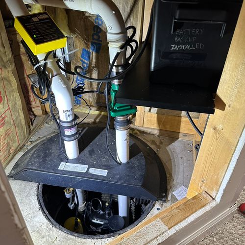Battery backup system with sump pump 