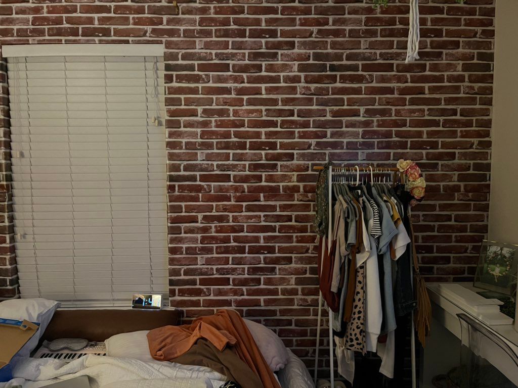 Put up a plastic brick wall with bulletin board pa