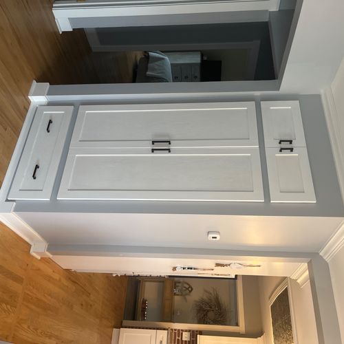 Had a coat closet built with an over sized drawer 