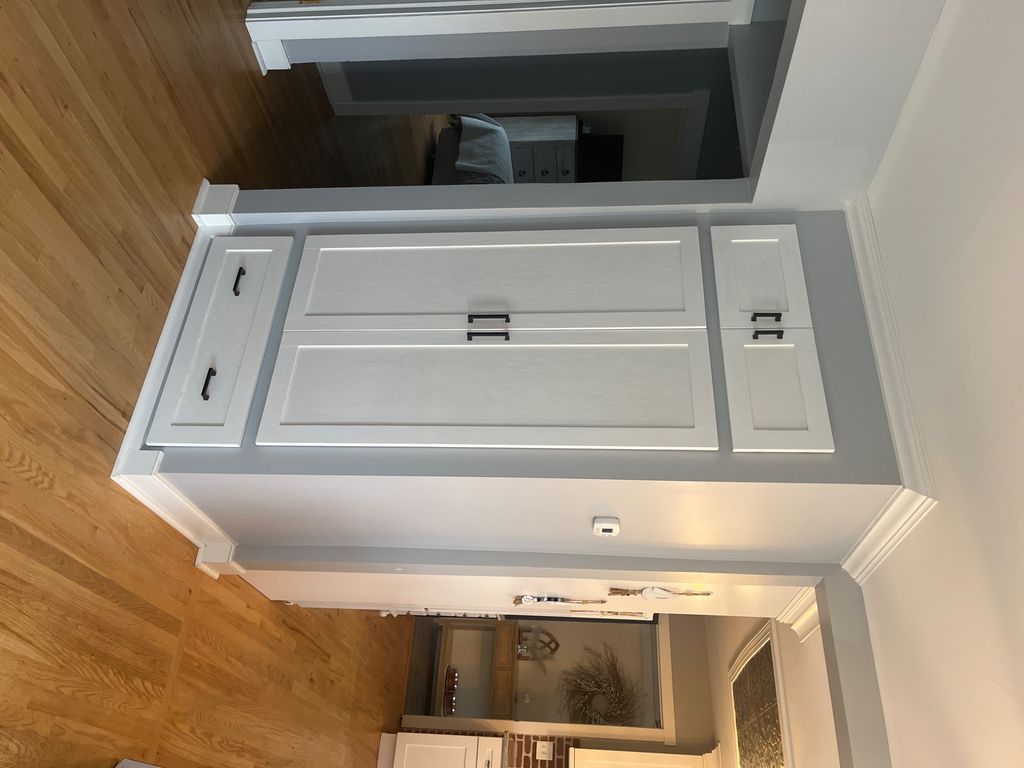 Had a coat closet built with an over sized drawer 