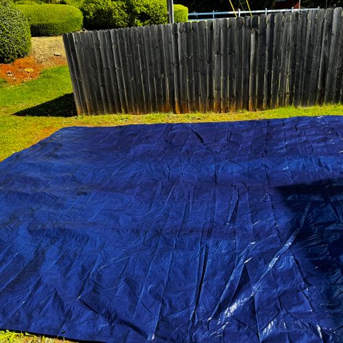 tarp laid out for outdoor pool install
