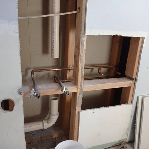 Remodeling bathroom. Reducing two water outlets an