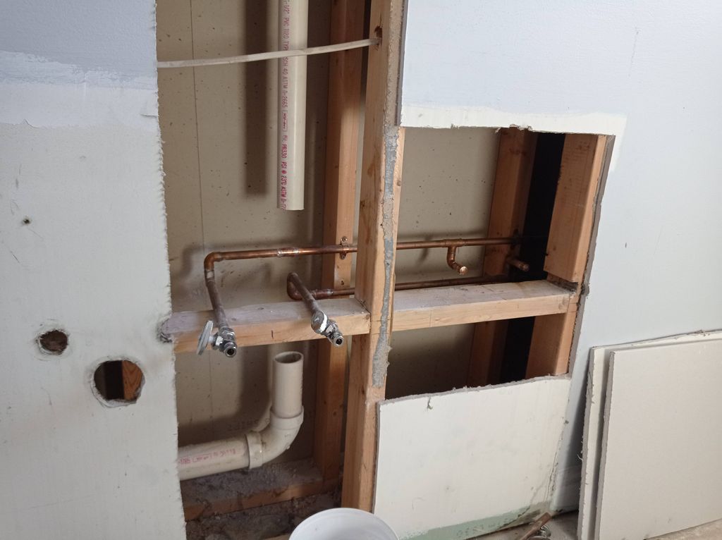 Remodeling bathroom. Reducing two water outlets an