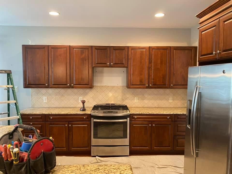Before old maple cabinets to new white shaker cabi
