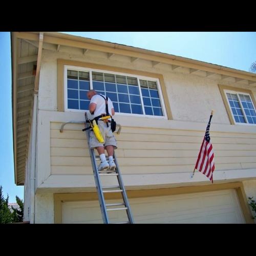 Repairing window that allowed racoons to make a ho