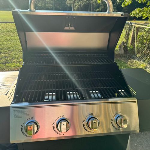 Justin assembled a gas grill and a trampoline for 