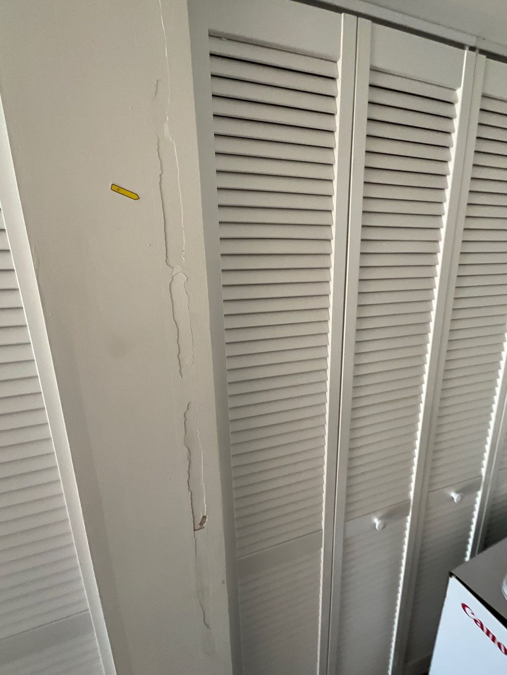 Drywall damage along side of door fram