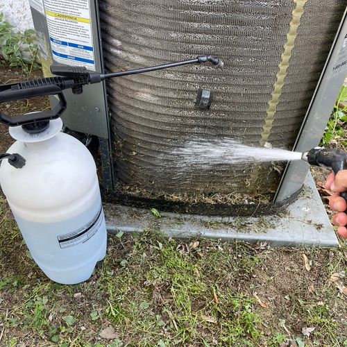Water washing an AC coil
