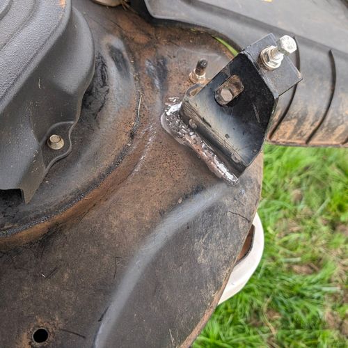 My hinge on my riding lawnmower snapped at the wel