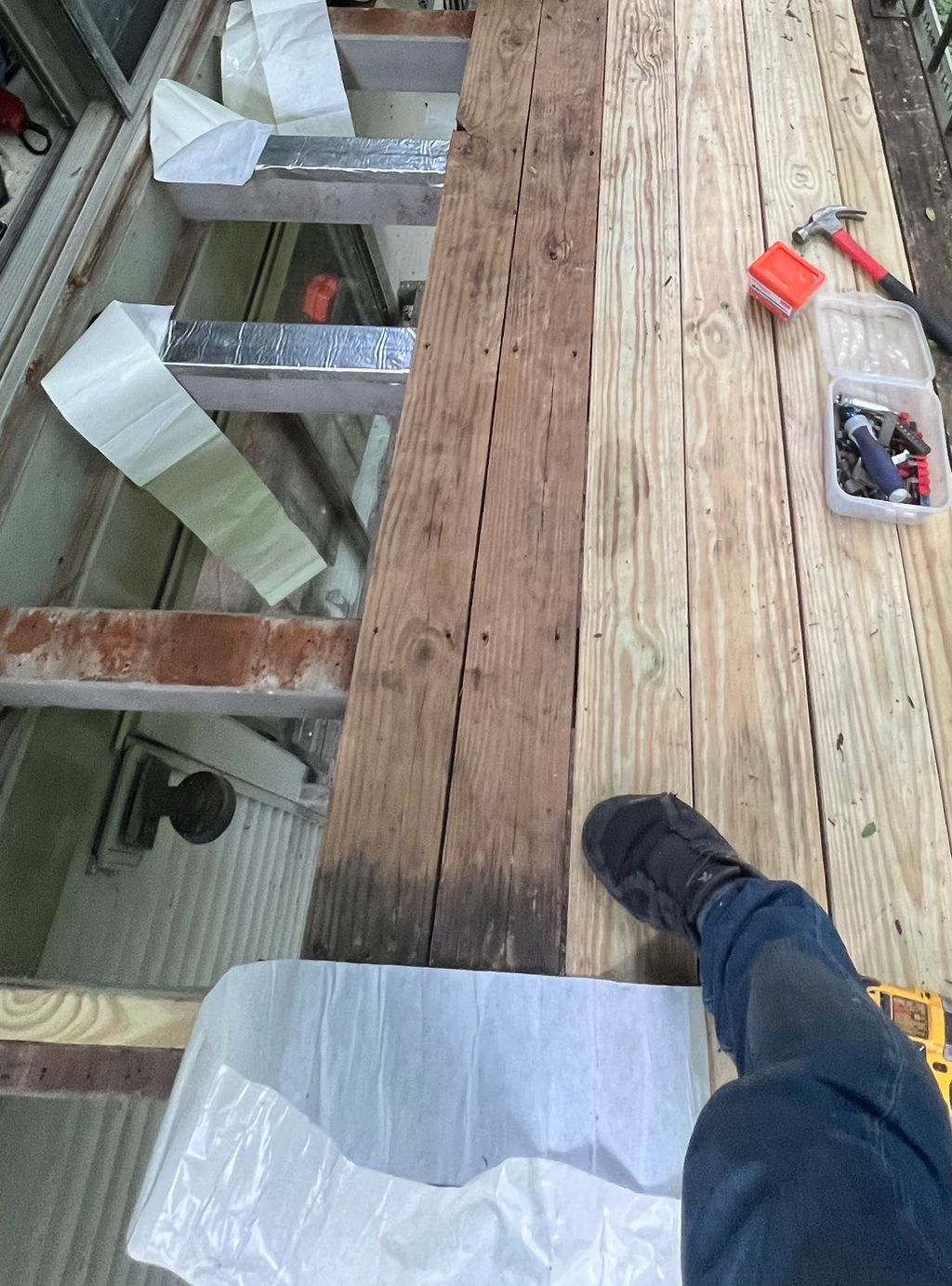 Deck during repair showing flashing installed over