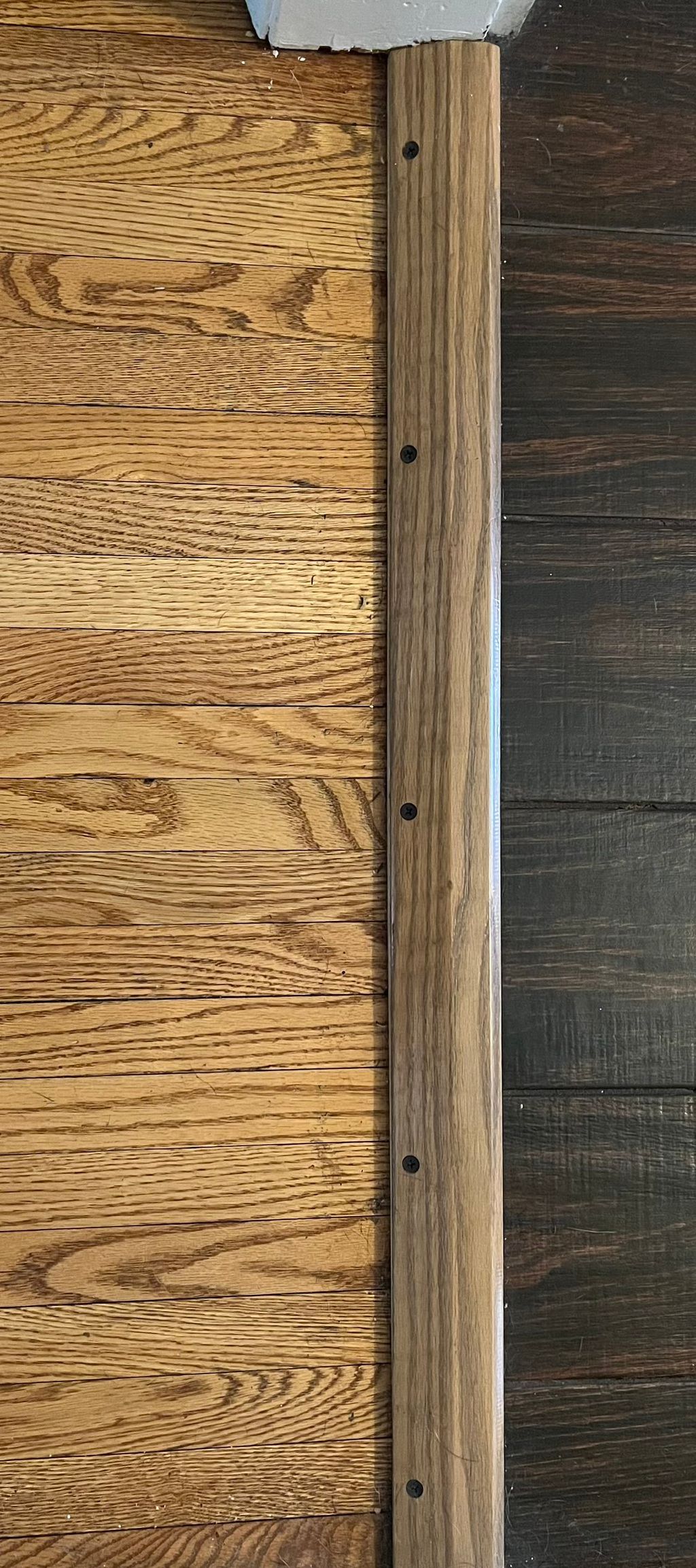 Stained new hardwood threshold to match 100+ year 