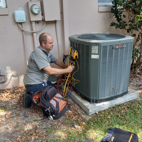 Justin F checking the refrigerant charge