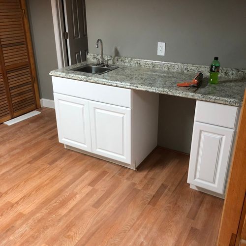 Installed new bar sink with cabinets in the baseme