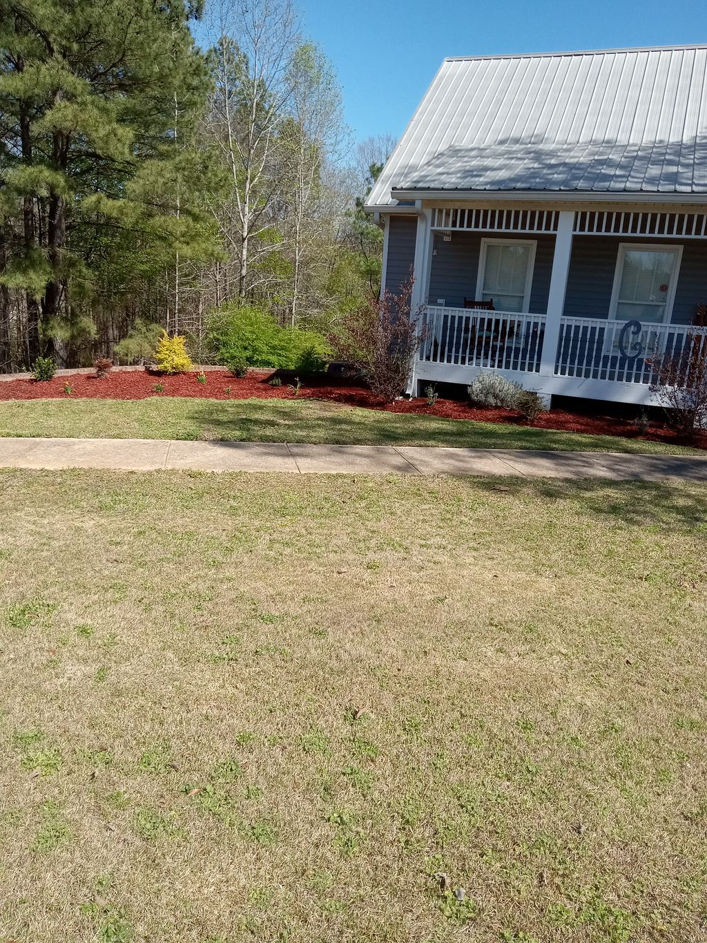 Mulching, mowing, planting around mulched area and