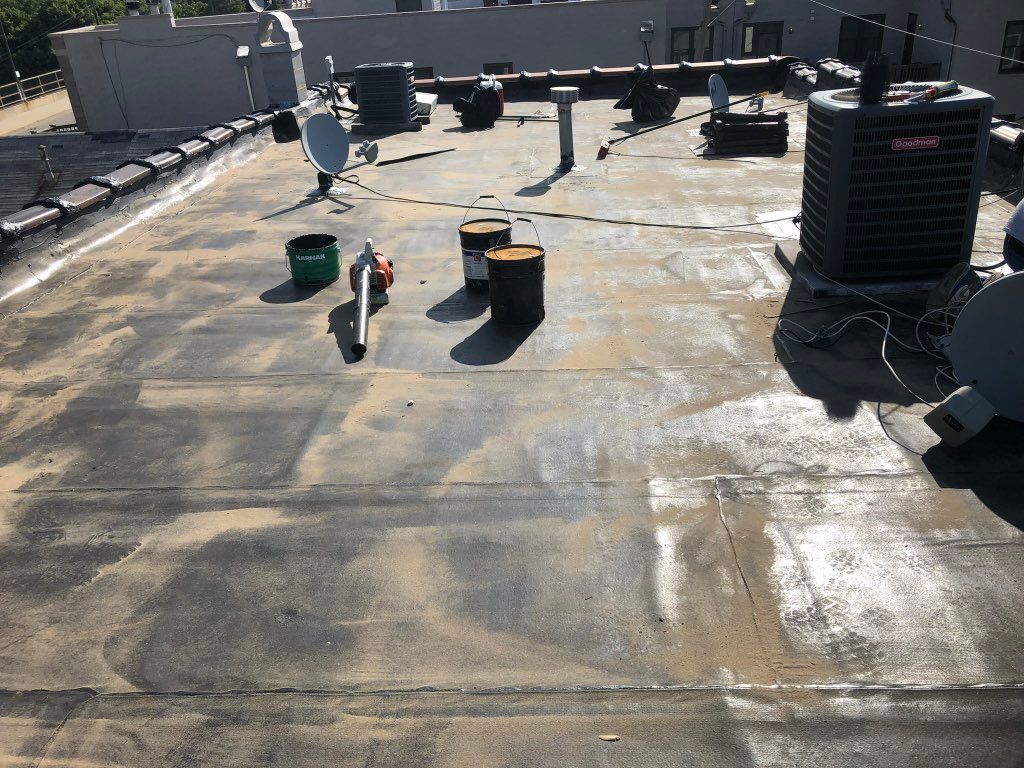 Before flat roof repair and silver coating 