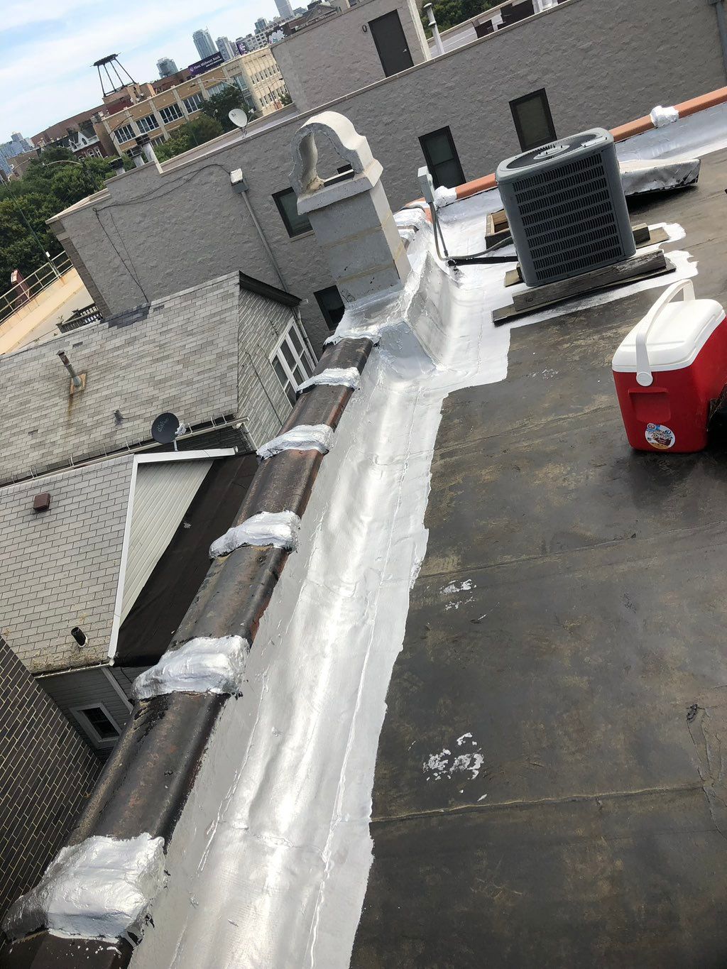 Before flat roof repair and silver coating 