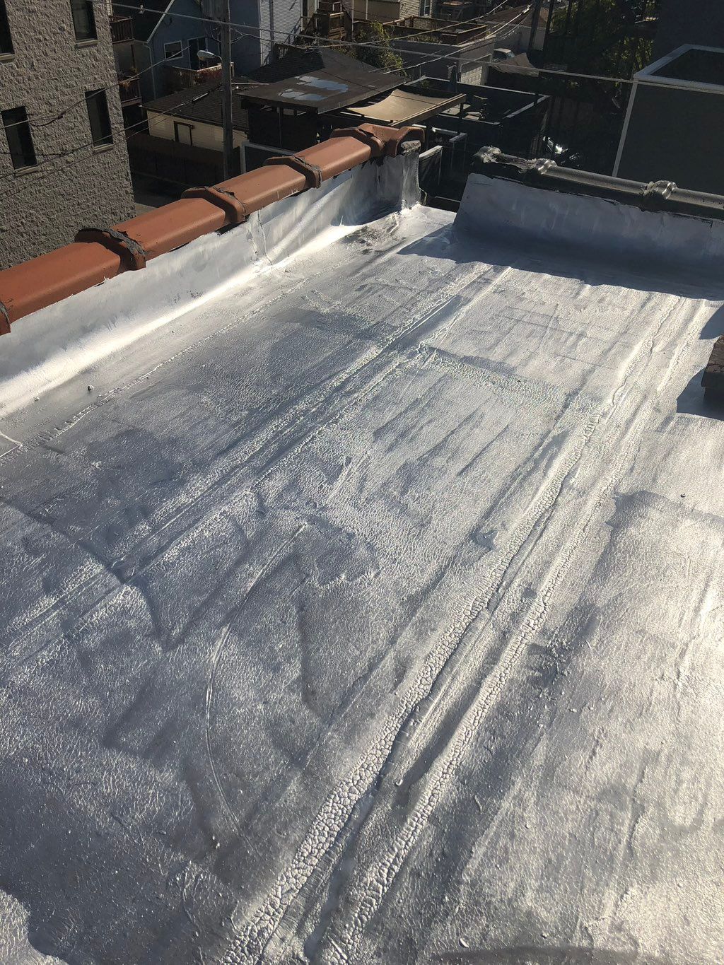 After… flat roof repair and silver coating 
