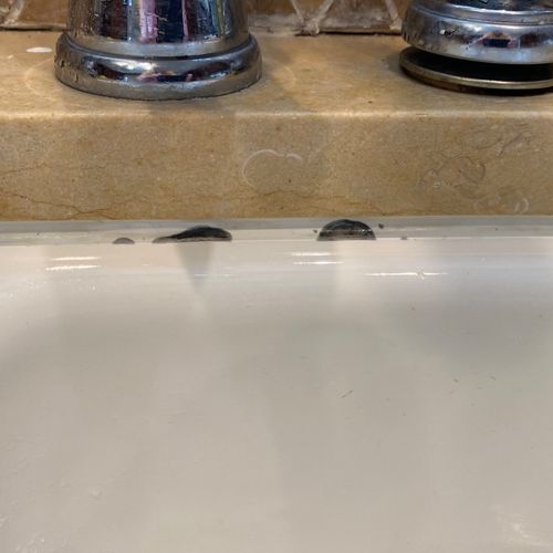 I recently hired Alex to re-caulk the ceramic sink