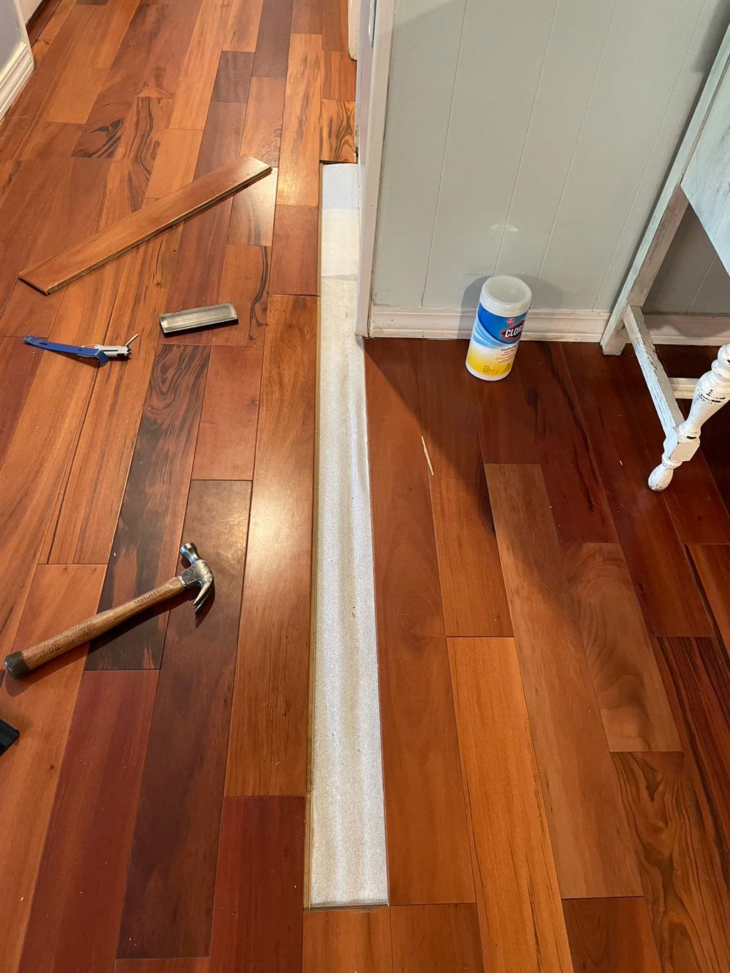 Buckled flooring due to misalignment and temperatu