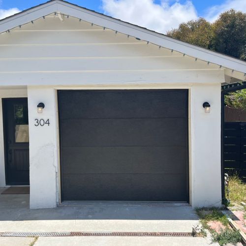 Replaced our old, wooden garage door with a beauti