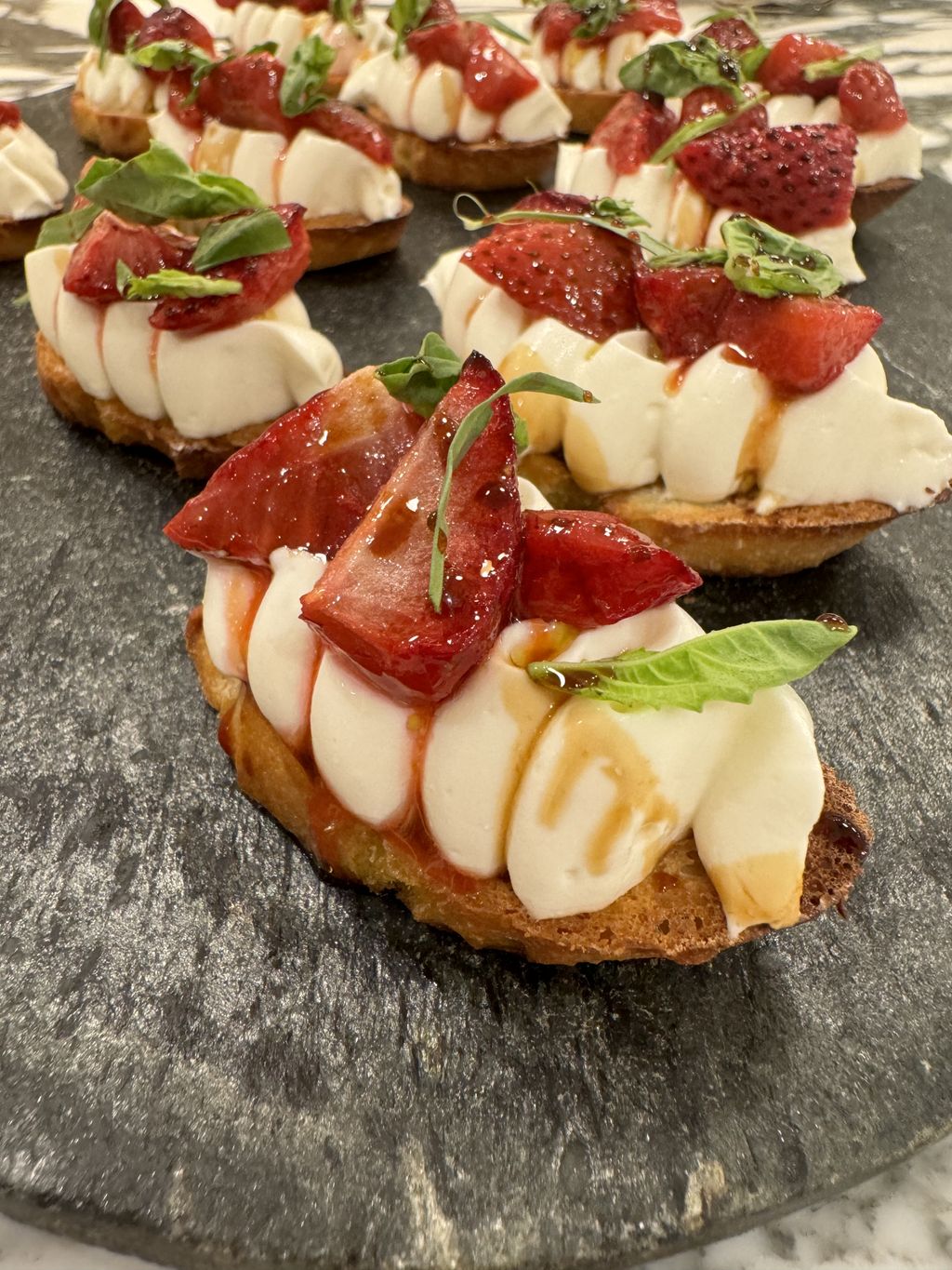 Crostini with whipped ricotta, local strawberries,