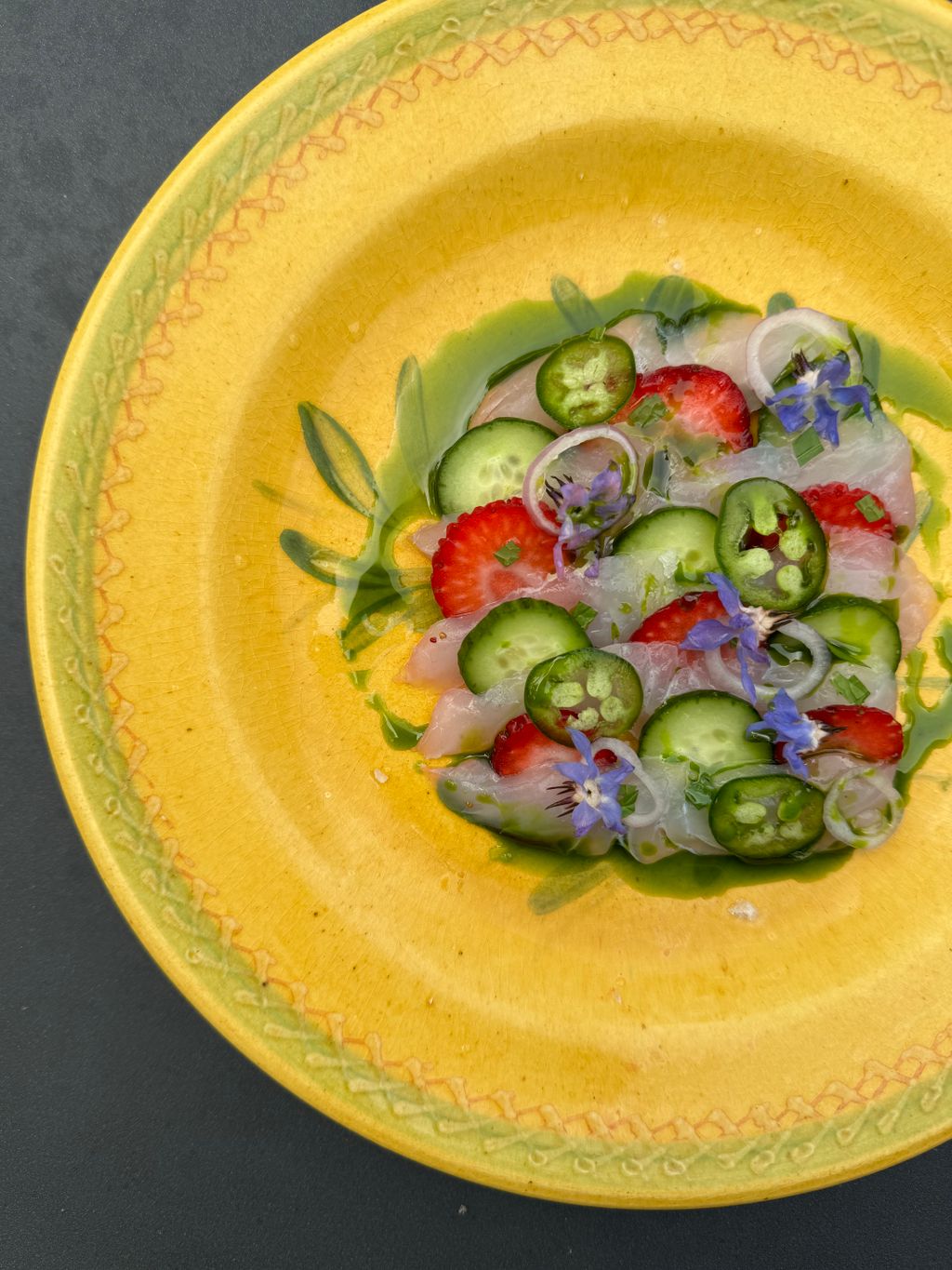 Black Bass Crudo with strawberries, cucumber and j