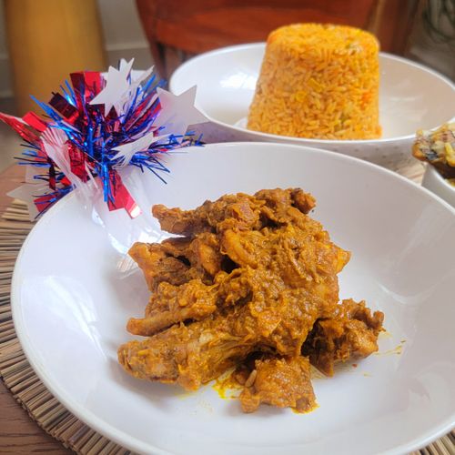 Palm Butter sauce (Foreground) and Jollof Rice (In