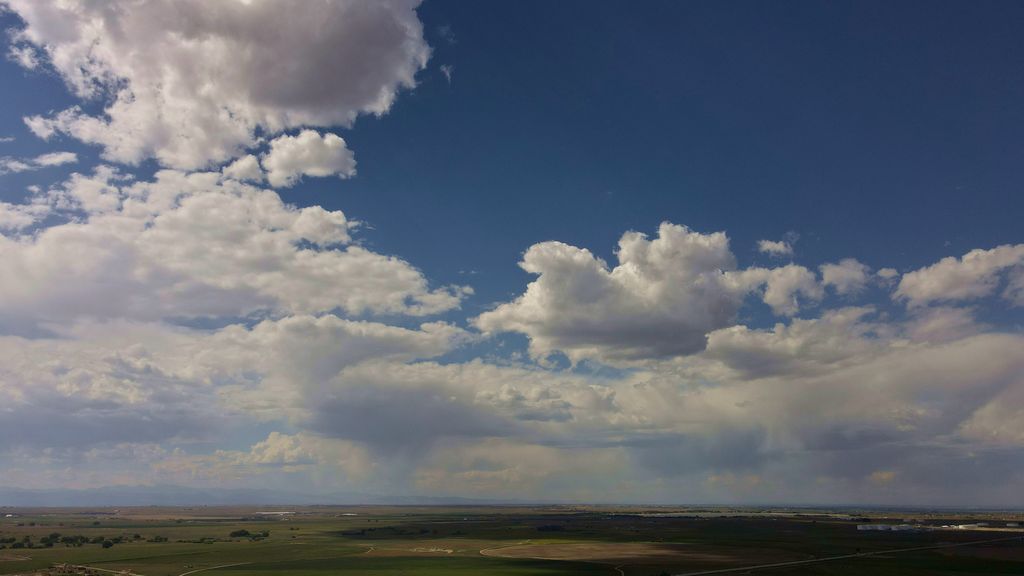 Mid-day partly cloudy skies in ~10 knot winds