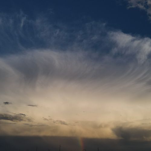 Tail end of thunderstorm with rainbow