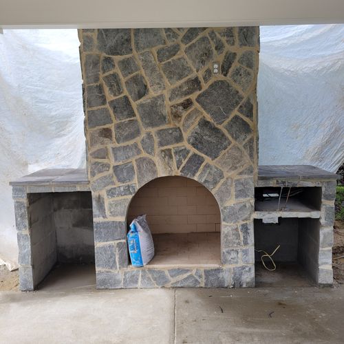 Stone front Fireplace / Entertainment center